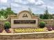 Chattahoochee River Club entrance sign with stone base and landscaping at 4260 River Club Dr, Cumming, GA 30041