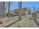 The house has a grassy backyard with a two-story deck at 1975 Hunt Crossing Ct, Lawrenceville, GA 30043