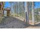 View of the backyard with deck, fence, and trees at 1975 Hunt Crossing Ct, Lawrenceville, GA 30043