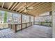Spacious wooden deck with ceiling fans and railings overlooking a treed backyard at 1975 Hunt Crossing Ct, Lawrenceville, GA 30043
