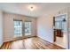 Dining room with hardwood floors and bright windows overlooking the yard at 1975 Hunt Crossing Ct, Lawrenceville, GA 30043