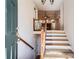Bright entryway featuring hardwood floors, staircase, and an open layout at 1975 Hunt Crossing Ct, Lawrenceville, GA 30043