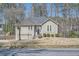 Charming home featuring a well-maintained front yard and inviting architecture at 1975 Hunt Crossing Ct, Lawrenceville, GA 30043