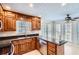 Kitchen featuring custom wood cabinets, granite countertops, and stainless appliances at 1975 Hunt Crossing Ct, Lawrenceville, GA 30043