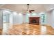 Open living room boasting a fireplace, hardwood floors, and natural light at 1975 Hunt Crossing Ct, Lawrenceville, GA 30043