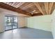 Bright living room with a sliding door to a balcony and beautiful wood ceiling and ceiling fan at 1975 Hunt Crossing Ct, Lawrenceville, GA 30043