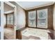 Primary bathroom boasts a soaking tub with wall-to-wall windows for natural light at 1975 Hunt Crossing Ct, Lawrenceville, GA 30043
