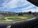 View of Coolray Field featuring the baseball field, seating, and apartment buildings in the background at 3387 Wild Clary Court Lot 20, Buford, GA 30519