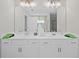Bathroom featuring double vanity with sleek fixtures and plenty of counter space at 3387 Wild Clary Court Lot 20, Buford, GA 30519