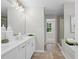 Bathroom featuring double vanity with sleek fixtures and plenty of counter space at 3387 Wild Clary Court Lot 20, Buford, GA 30519