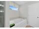 Bright and inviting bathroom with a soaking tub and a separate shower stall at 3387 Wild Clary Court Lot 20, Buford, GA 30519