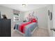 Welcoming bedroom with warm tones, artwork, and a large window with neighborhood view at 3387 Wild Clary Court Lot 20, Buford, GA 30519