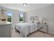 Comfortable bedroom with neutral color palette, large windows, and ample natural light at 3387 Wild Clary Court Lot 20, Buford, GA 30519