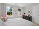 Relaxing bedroom with natural light, neutral walls, and a comfortable bed at 3387 Wild Clary Court Lot 20, Buford, GA 30519
