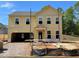 New construction home featuring a two-story layout, neutral siding, and an attached two-car garage at 3387 Wild Clary Court Lot 20, Buford, GA 30519