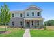 Charming two-story home with a brick facade, covered porch, and manicured lawn at 3387 Wild Clary Court Lot 20, Buford, GA 30519