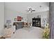 Inviting living room with gray sofa, black display cabinet, and neutral tones, creating a cozy atmosphere at 3387 Wild Clary Court Lot 20, Buford, GA 30519