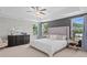 A cozy main bedroom with large bed, tray ceiling, and neutral color palette at 3387 Wild Clary Court Lot 20, Buford, GA 30519