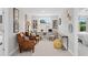 Office area featuring built in desk, brown leather chairs, natural lighting, and soft tan carpet at 3387 Wild Clary Court Lot 20, Buford, GA 30519