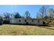 This is the back exterior of the home with a big grassy yard at 4214 Canby Ln, Decatur, GA 30035