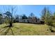 Spacious backyard with a white house in the background, perfect for outdoor activities and relaxation at 4214 Canby Ln, Decatur, GA 30035