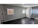 Cozy bedroom featuring hardwood floors, natural light, and closet space at 4214 Canby Ln, Decatur, GA 30035