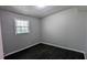 Inviting bedroom offers a neutral color scheme, dark hardwood floors, and a window at 4214 Canby Ln, Decatur, GA 30035