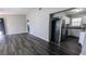 Open living space that flows into the kitchen, featuring stainless steel appliances and ample counter space at 4214 Canby Ln, Decatur, GA 30035