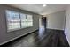 Bright living room with hardwood floors and large windows offering plenty of natural light at 4214 Canby Ln, Decatur, GA 30035