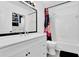 Bright bathroom featuring a white vanity, mirror, and tub with a decorative shower curtain at 708 Mill Pond Se Dr, Smyrna, GA 30082