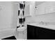 Clean bathroom featuring a shower-tub combo with decorative curtain and modern vanity sink at 708 Mill Pond Se Dr, Smyrna, GA 30082