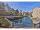 Scenic waterfront property with buildings reflecting in the water, captured from an elevated vantage point at 708 Mill Pond Se Dr, Smyrna, GA 30082