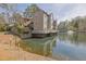 Beautiful condo complex with a lake view, featuring private decks and a tranquil fountain at 708 Mill Pond Se Dr, Smyrna, GA 30082