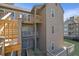 Multi-level condo exterior with wooden balconies and a serene natural view at 708 Mill Pond Se Dr, Smyrna, GA 30082
