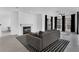 Spacious living room with fireplace, modern flooring, large windows, and a ceiling fan at 708 Mill Pond Se Dr, Smyrna, GA 30082