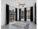 Bright room featuring expansive windows with dark curtains and contemporary gray flooring at 708 Mill Pond Se Dr, Smyrna, GA 30082
