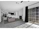 Open-concept living area with sliding glass door, modern flooring, and neutral decor at 708 Mill Pond Se Dr, Smyrna, GA 30082