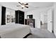 Relaxing bedroom with ceiling fan, fireplace, and large windows for natural light at 708 Mill Pond Se Dr, Smyrna, GA 30082