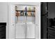 Pantry closet with washer, dryer and shelving for storage at 708 Mill Pond Se Dr, Smyrna, GA 30082