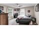 Neutral bedroom with a ceiling fan and large windows at 144 Bobs Sw Dr, Mableton, GA 30126