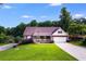 Traditional home with brick facade, a covered porch, and a well-kept lawn under a blue sky at 144 Bobs Sw Dr, Mableton, GA 30126