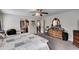 Well-lit main bedroom showing traditional furnishings and access to the main bath at 144 Bobs Sw Dr, Mableton, GA 30126