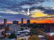 Sunset panorama over an urban skyline highlights city living at 2870 Pharr Court South Nw # 2402, Atlanta, GA 30305