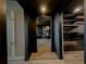 Hallway looking into dining room and walk-in closet with custom shelving at 2870 Pharr Court South Nw # 2402, Atlanta, GA 30305