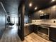 Open-concept kitchen with stainless steel appliances and a seamless connection to the living area at 2870 Pharr Court South Nw # 2402, Atlanta, GA 30305