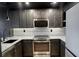 Modern kitchen with stainless steel appliances, sleek cabinetry, and elegant marble countertops at 2870 Pharr Court South Nw # 2402, Atlanta, GA 30305