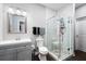 Modern bathroom showcasing a glass shower, grey vanity and neutral tiling at 359 Flatstone Sw Way, Marietta, GA 30064