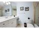 Bathroom with a wide mirror, neutral tile and a shower/tub combo at 359 Flatstone Sw Way, Marietta, GA 30064