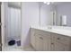 Bathroom with a large mirror, vanity, neutral tile and a shower/tub combo at 359 Flatstone Sw Way, Marietta, GA 30064