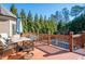 An outdoor deck with a dining table overlooking a swimming pool at 359 Flatstone Sw Way, Marietta, GA 30064